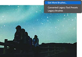 Star gazers on a fence are overwhelmed by a bright teal night sky with Get More Brushes dialog box overlaid