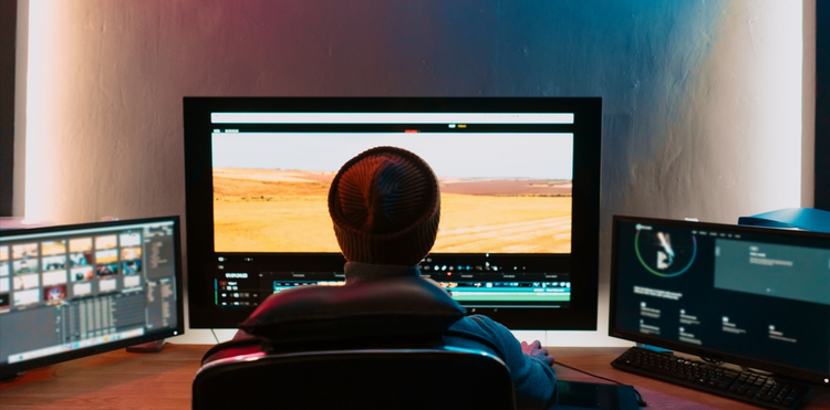 A person editing video on a computer