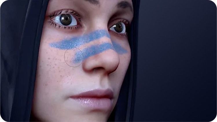 A woman with face-paint on the bridge of her nose