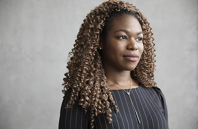 A person looking to the right and posing for a corporate headshot photo