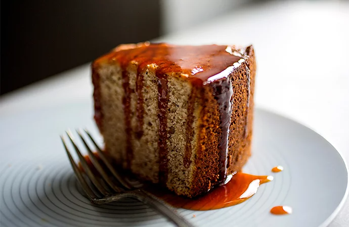 A close-up photo of a slice of cake on a plate