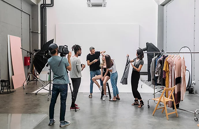 Production crew setting up a set indoors