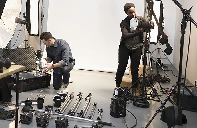 Production crew setting up a set indoors