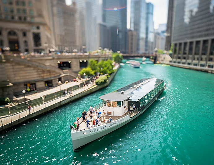 A boat on a river passing through a cityscape