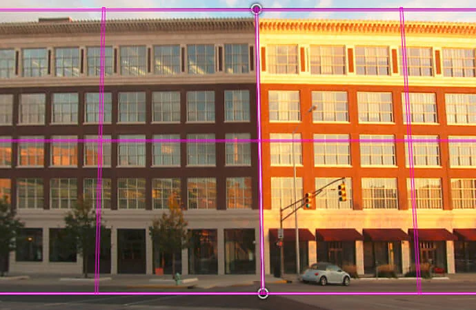 Photo of a building with purple perspective wireframe