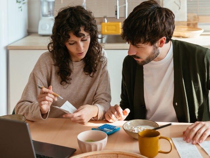 A photo of two people discussing a collateral loan agreement.