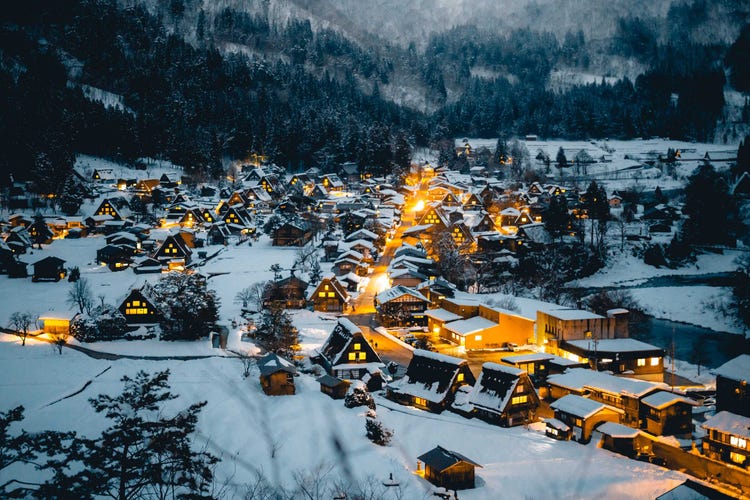 Small cabins covered in snow