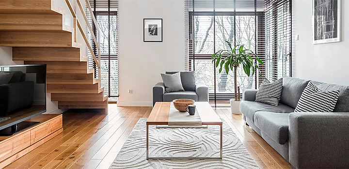 Wide shot of a furnished living room with natural lighting