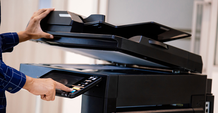 professional person using a scanner on a piece of paper