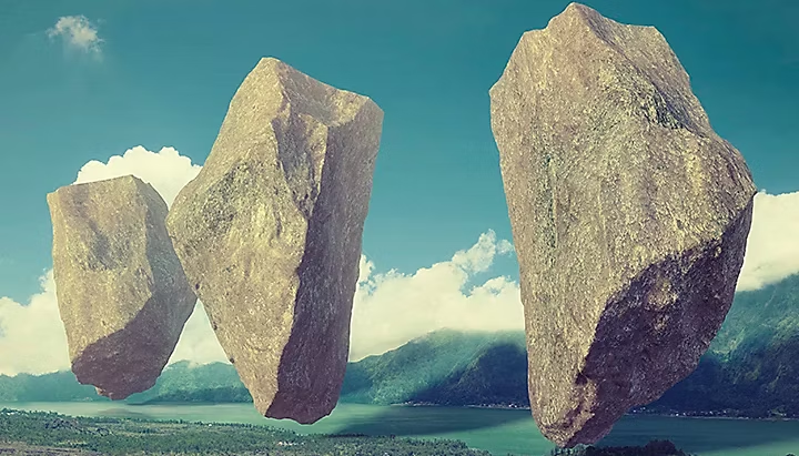 Giant rocks floating above landscape