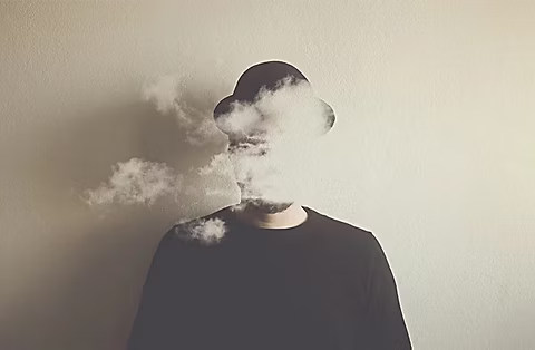 Smoke cloud in front of a person's face