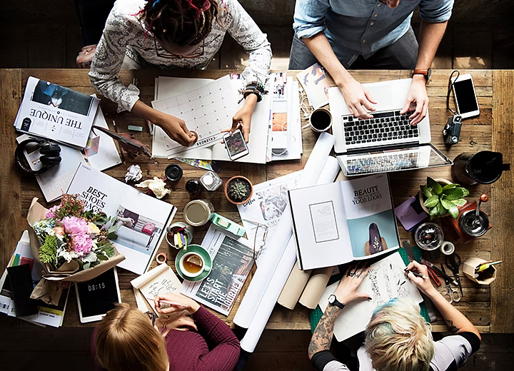 team of young professionals working on a magazine