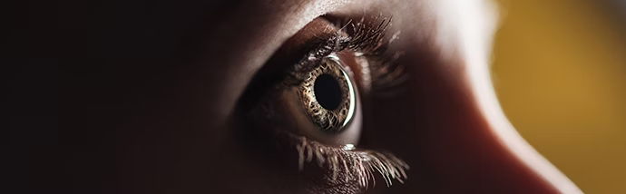 close-up-view-of-human-eye-looking-away-in-darkness-panoramic-shot