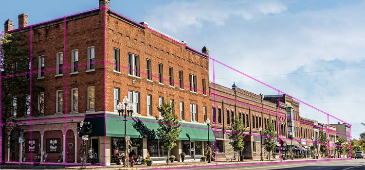 Brick building with purple lines highlighting a forced perspective