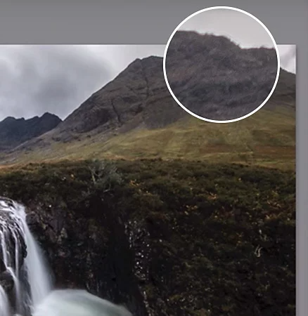 Showing that the chromatic aberration has been removed in a nature photography of a waterfall