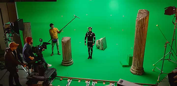 Production crew recording video on a green screen